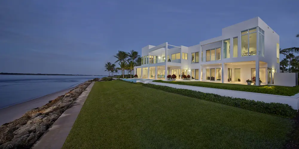 Embrace waterfront living with expansive glass facades and sleek terrace spaces offering panoramic views.