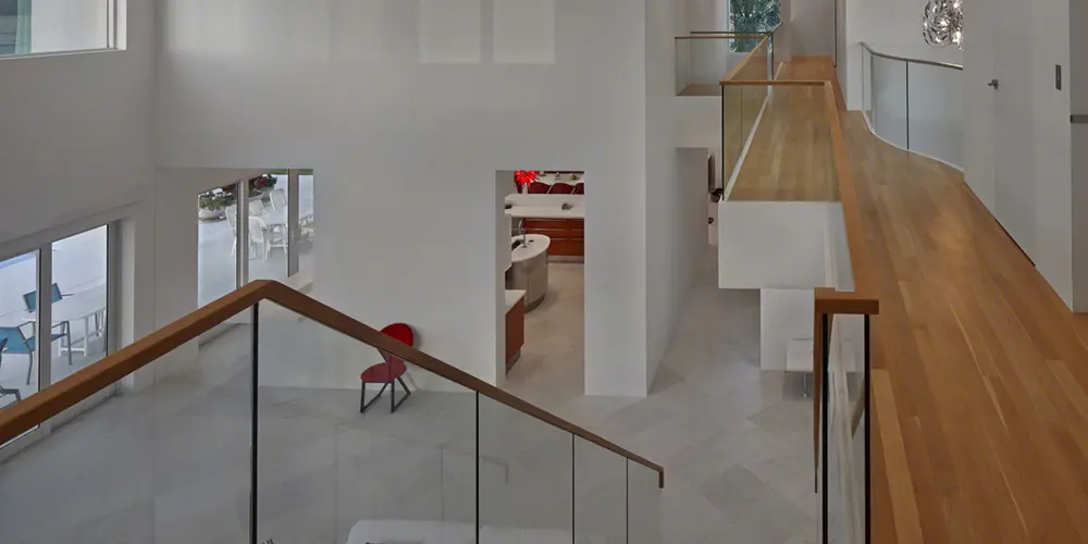 This overhead perspective highlights the open-plan connectivity throughout the interior, showcasing the blend of natural light with understated elegance.