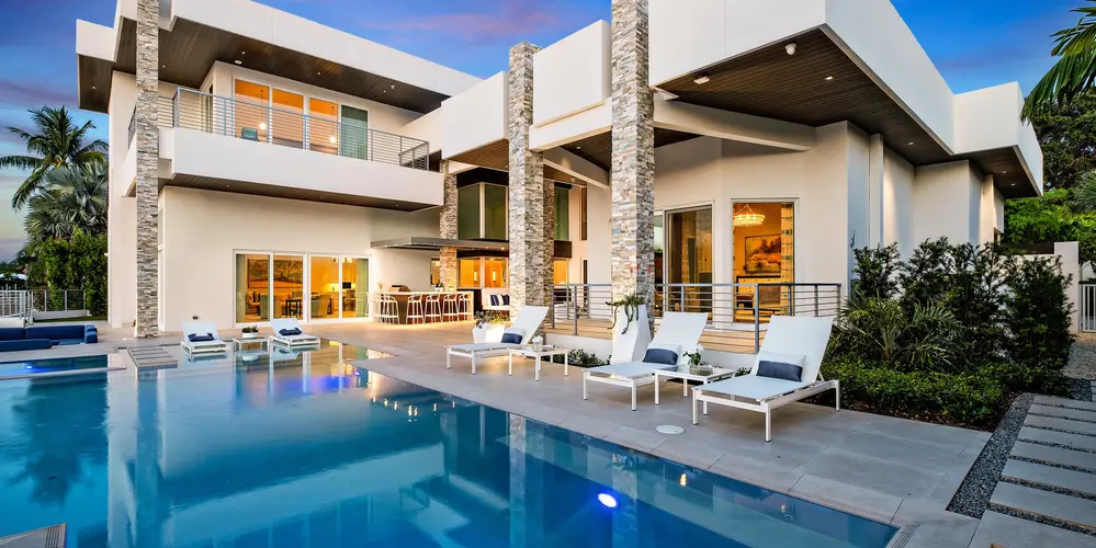This pool area encapsulates a luxurious experience with a spacious terrace. The outdoor areas are the crown of this project, visible thought the home through large glass sliding doors and windows. 
