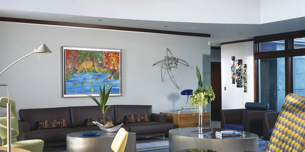 This colorful seating area brings artistic flair and modern design together, creating a lively and inviting social environment.